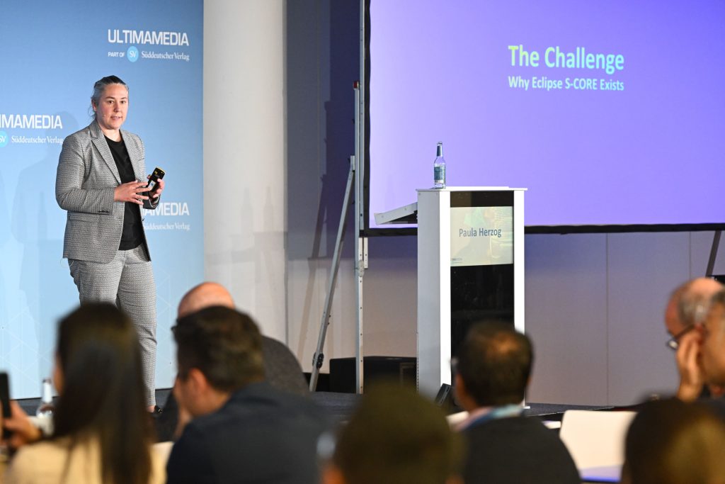 Paula Herzog, presented at the Automotive Software Strategies Conference in Munich. Her topic: what it actually takes to industrialize Eclipse S-CORE for safety-critical, real-time automotive programs.